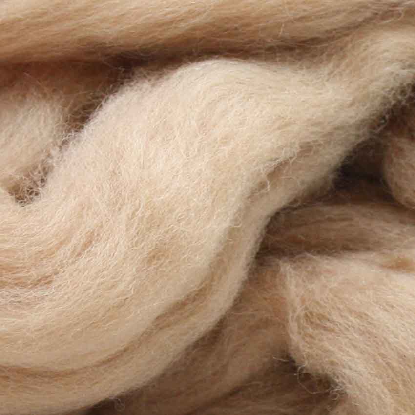 close up of corrie wool top for felting in caramel colour