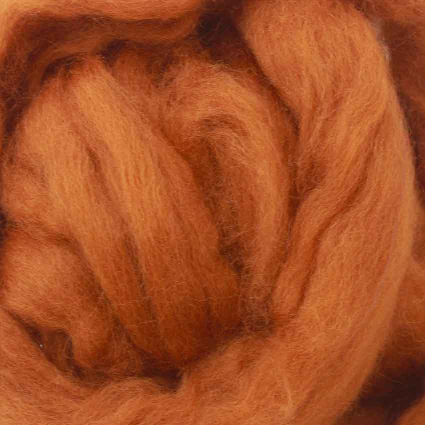 close up of corrie wool top for felting in foxy red brown colour