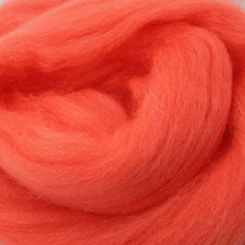 close up of corrie wool top for felting in zing orange colour
