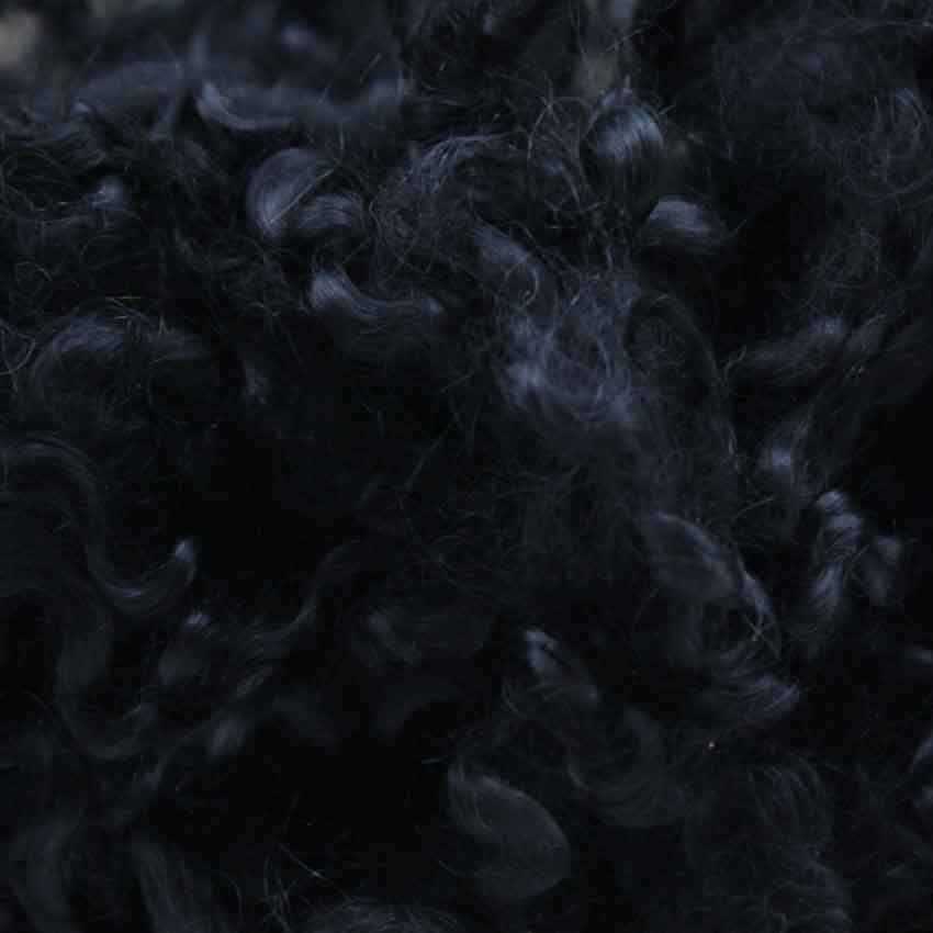 Close up of soot mohair curls showing deep coal nearly black colour