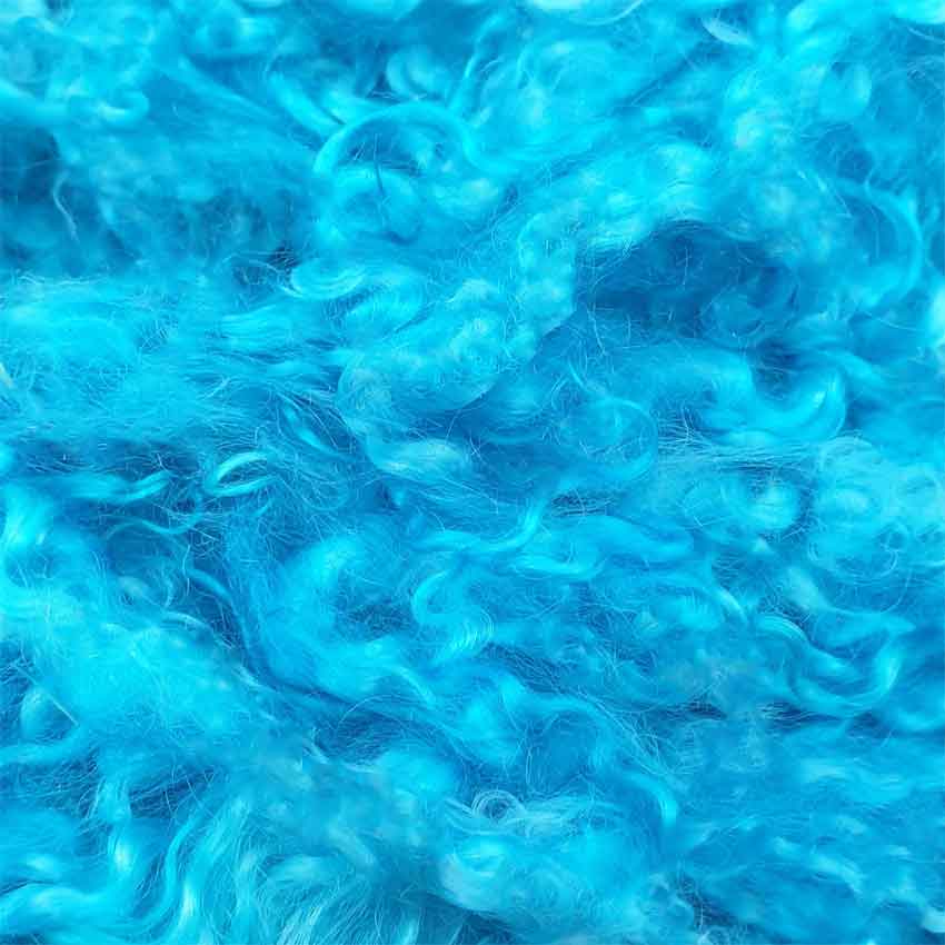 close up photo of cyan mohair curls 